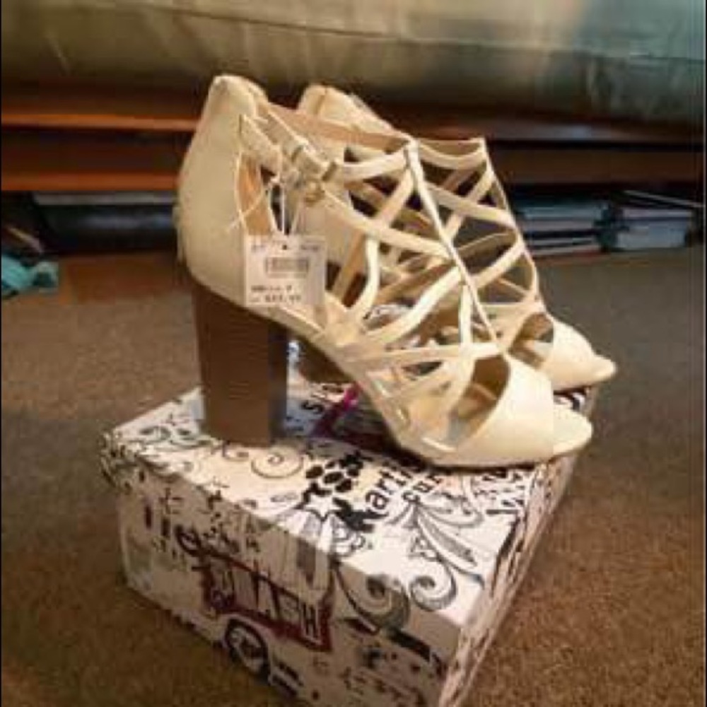 Women’s size 9, white straps heel